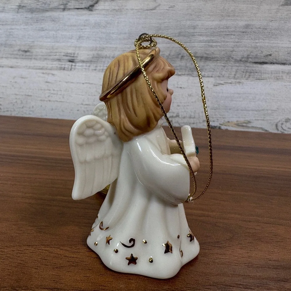 Lenox May birthstone Porcelain Angel Ornament features a hand-painted gold halo